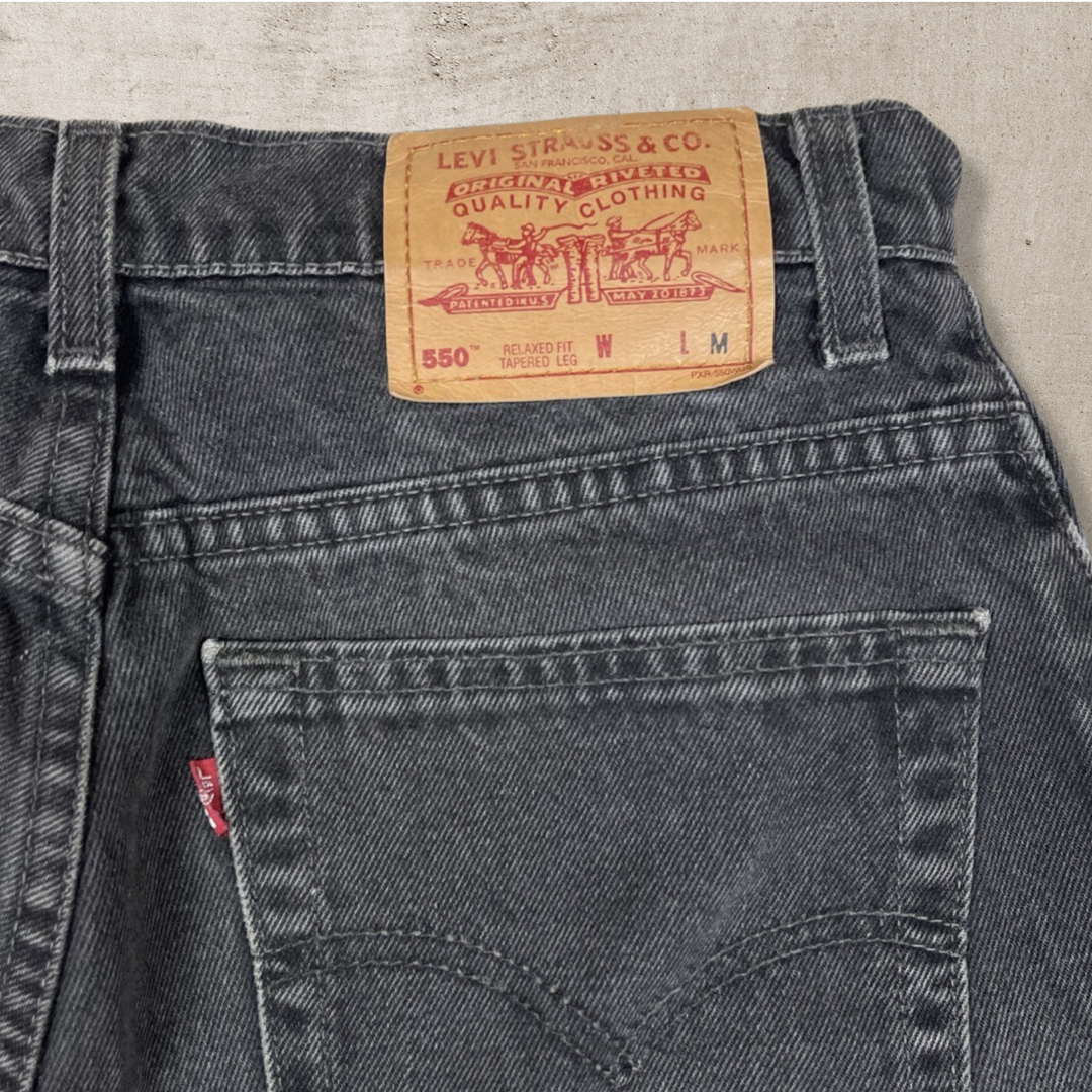 90s VINTAGE WOMEN'S LEVI'S 550 FADED BAGGY JEANS (W10)